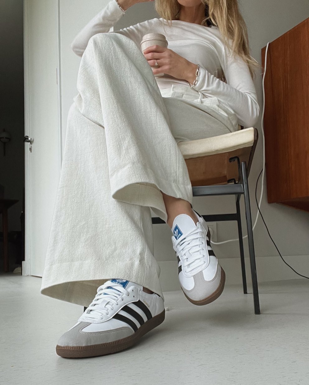 Adidas Samba: @anoukyve wears sambas with white denim and a long sleeve top