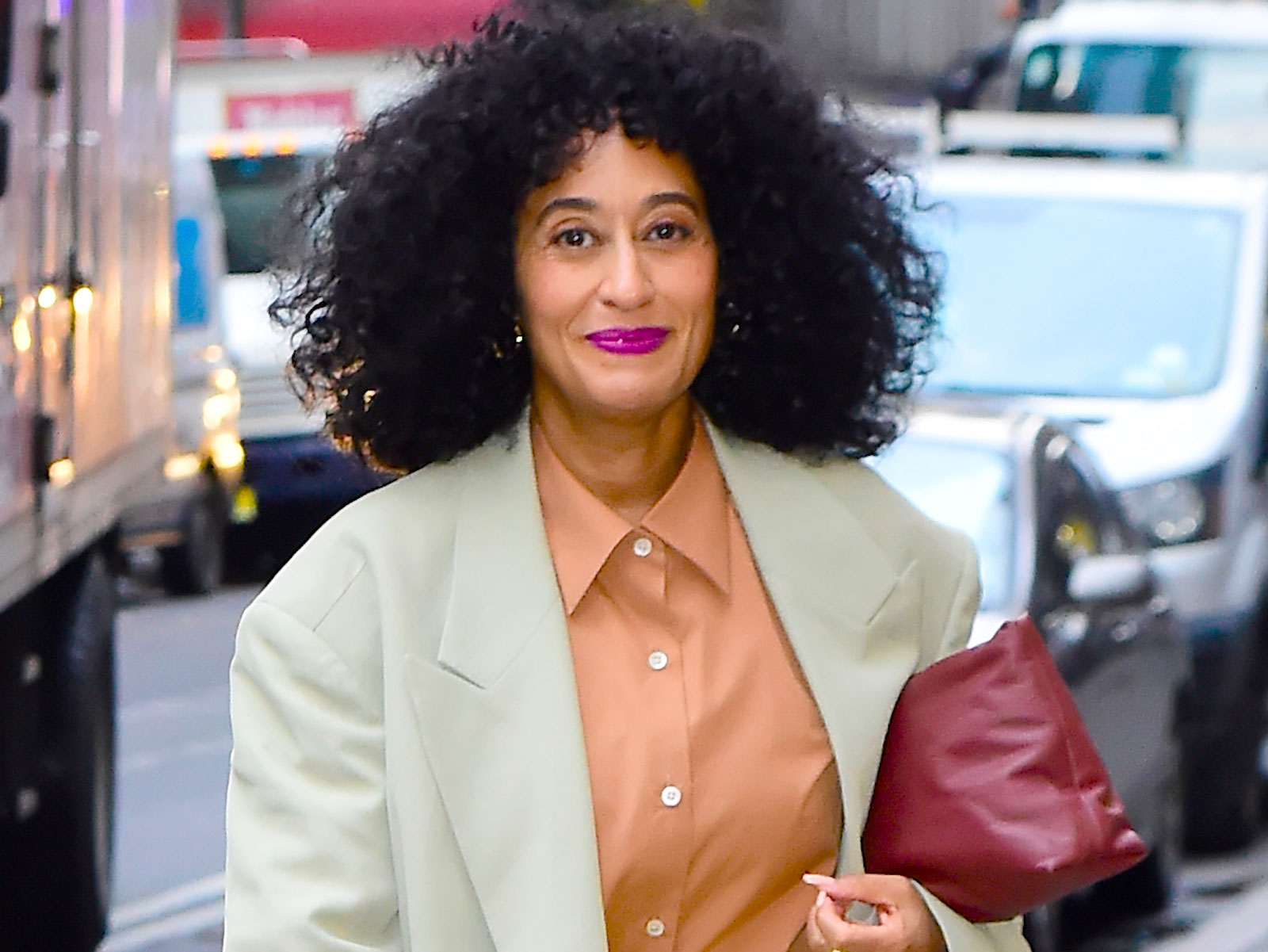 tracee ellis ross wearing gold boots