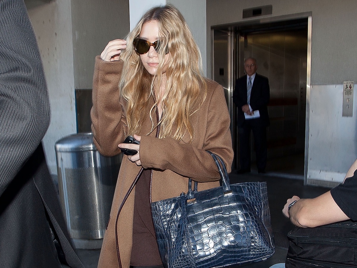 Ashley Olsen 11 Celebrity Airport Looks With Ballet Flats Camel Coat