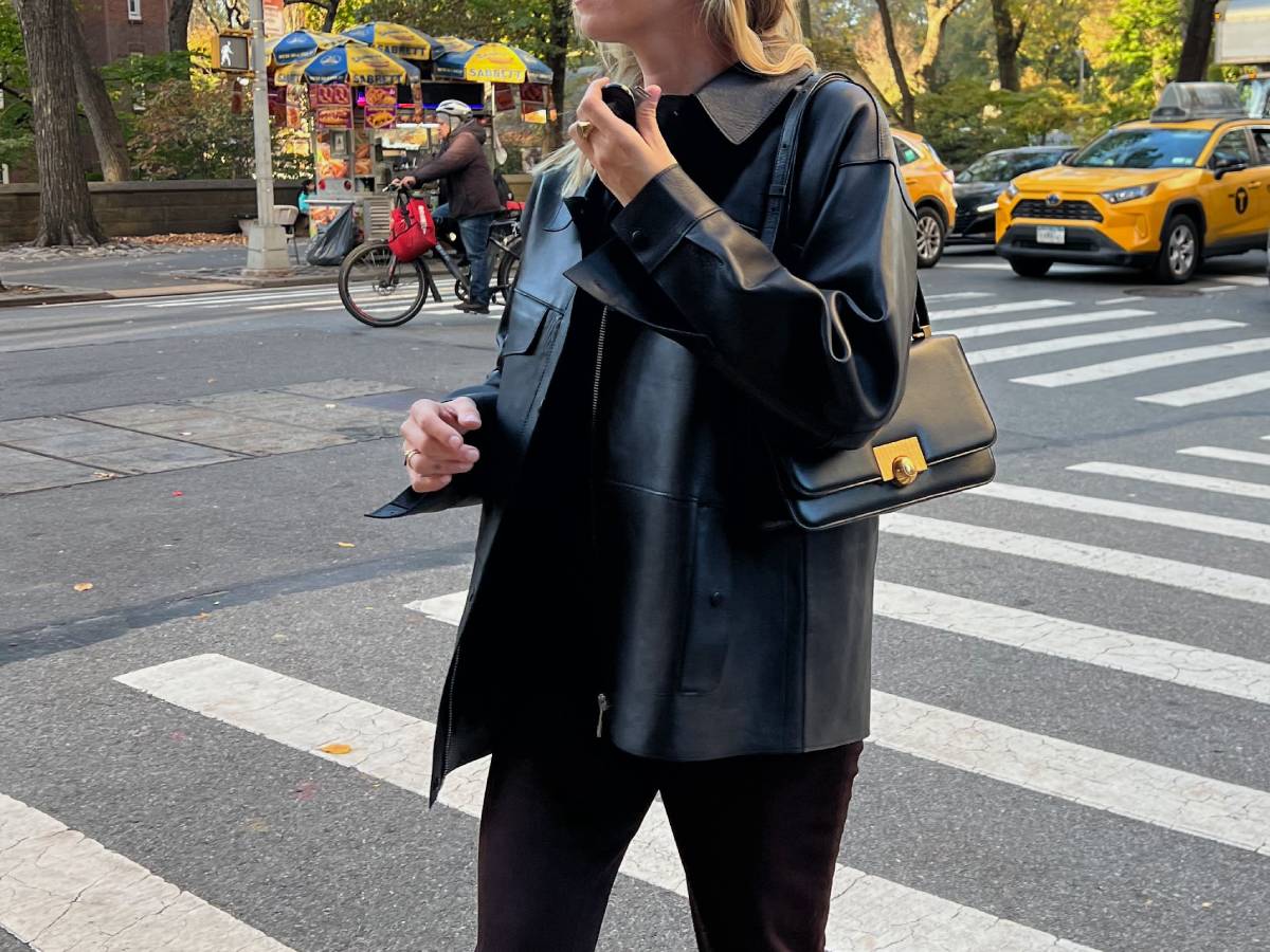Lindsey Holland wears Whistles' clean bonded leather jacket