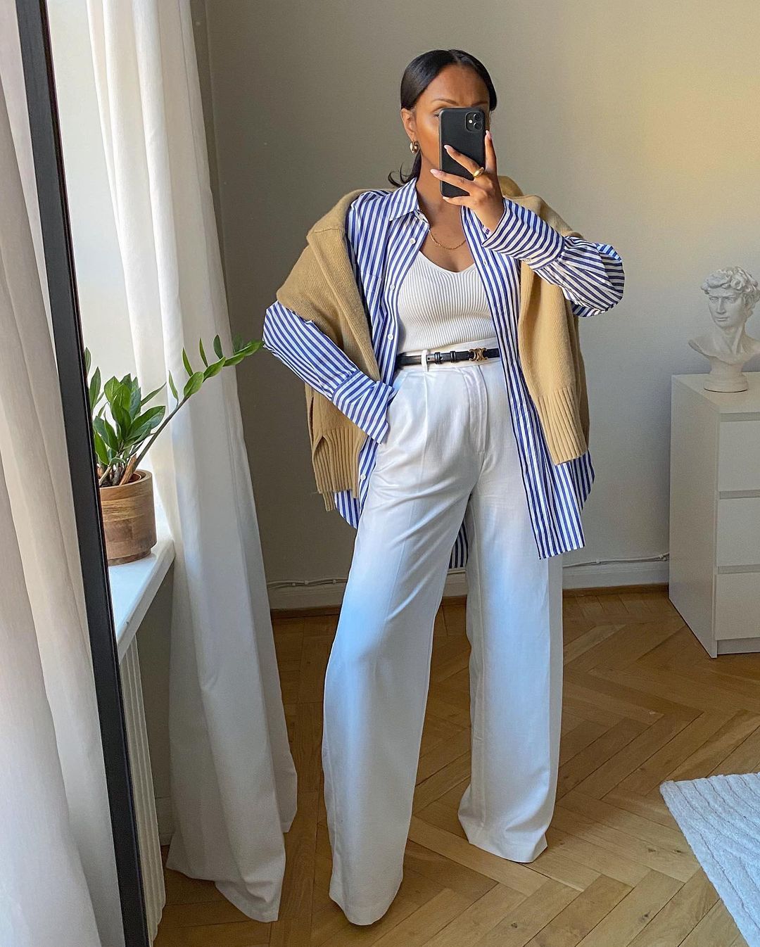 White trouser outfits: @femmeblk wears white trousers with a striped shirt