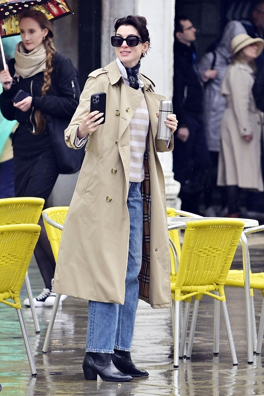 Anne Hathaway wearing a trench coat in Venice, Italy