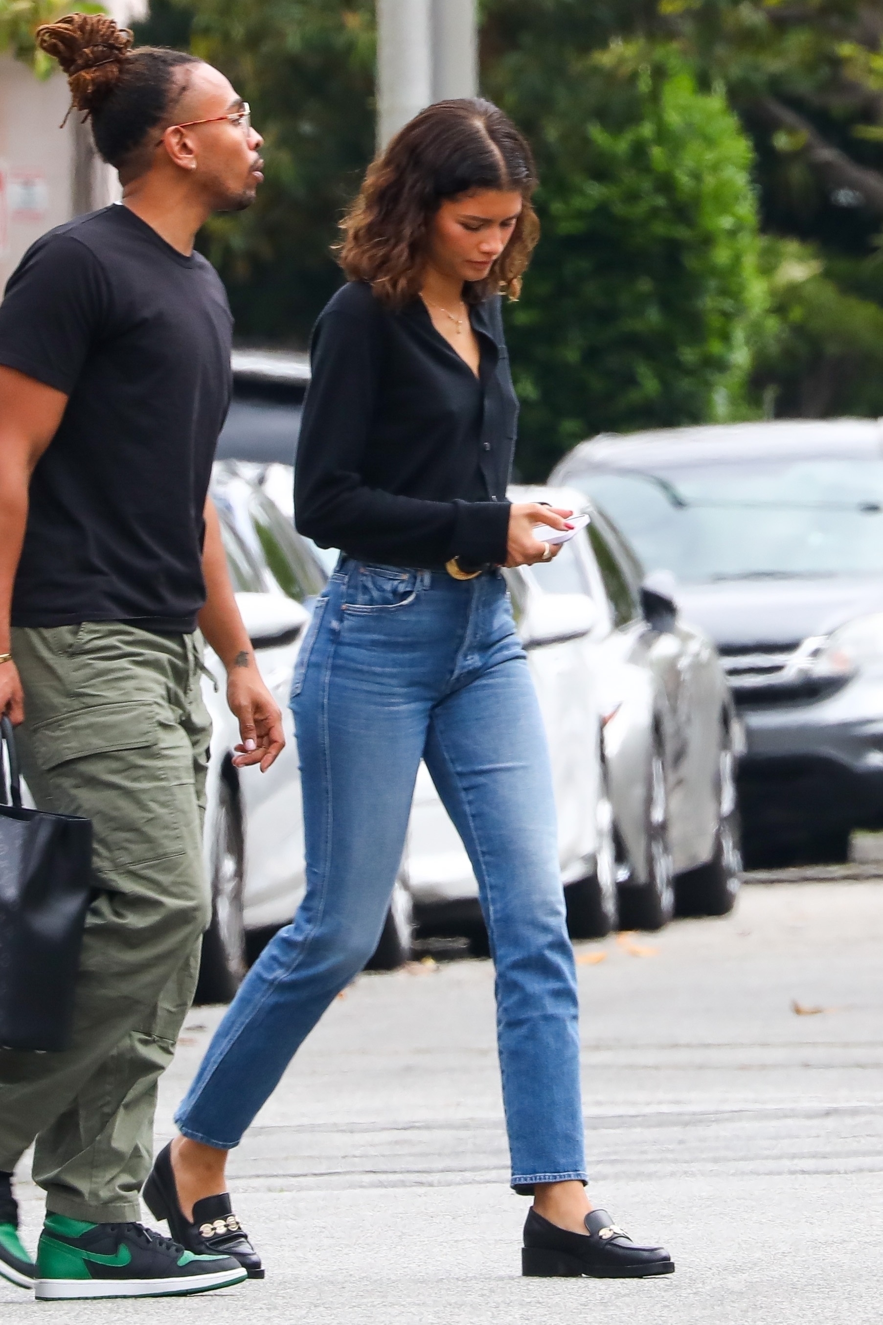 zendaya wearing skinny jeans and loafers