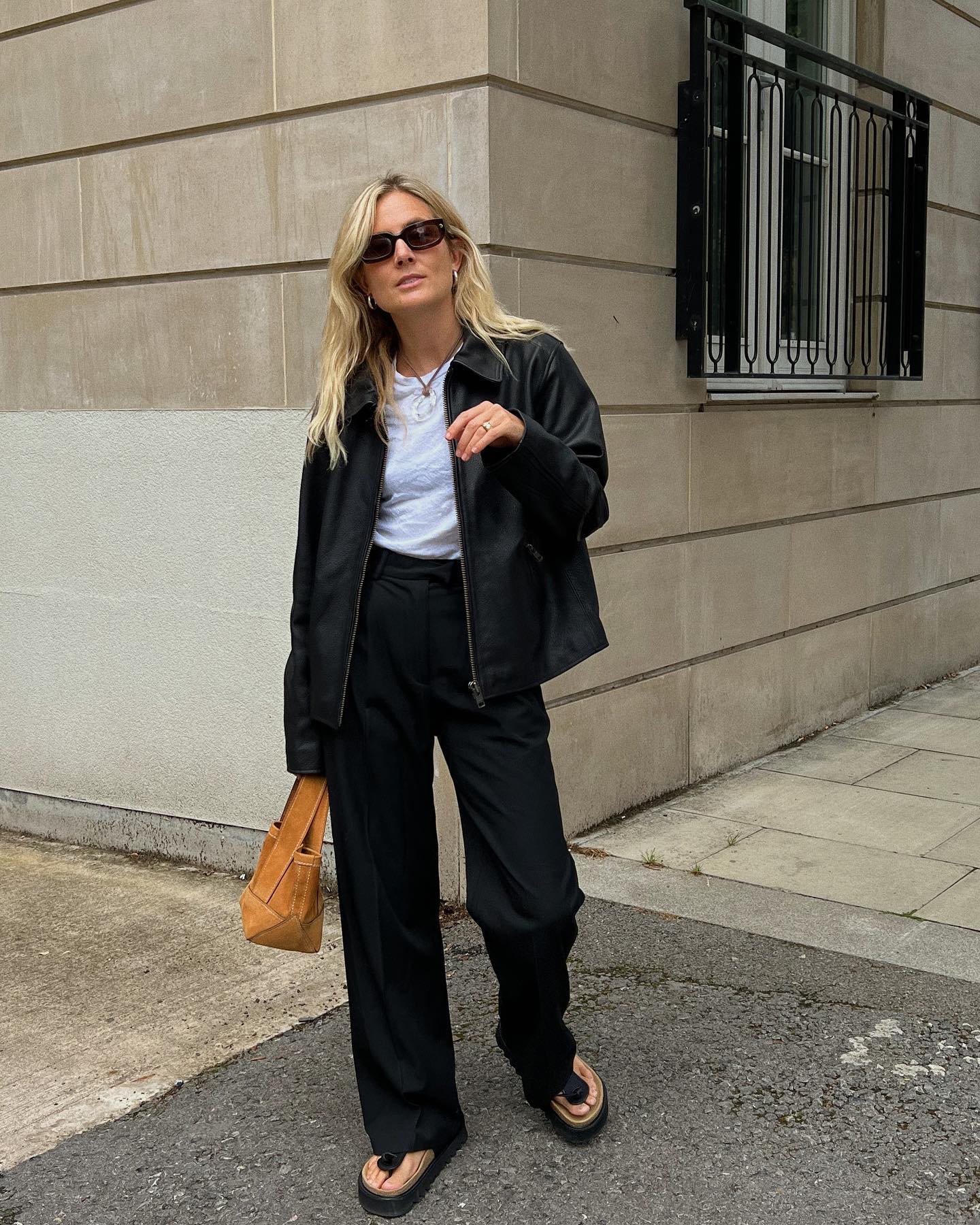 Influencer Lucy Williams 30 Fall Outfit Ideas Leather Bomber Jacket Black Trousers Platform Sandals